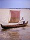 Burma / Myanmar: Rowing a small sailing boat on the Irrawaddy / Ayeyarwady River near Mandalay